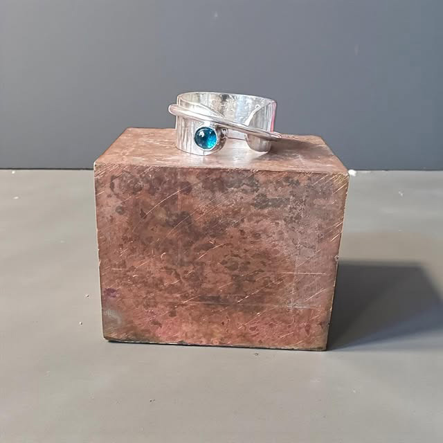 Ring with a blue stone