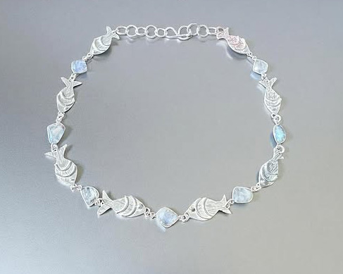 stargazer necklace with fishes and bluestones
