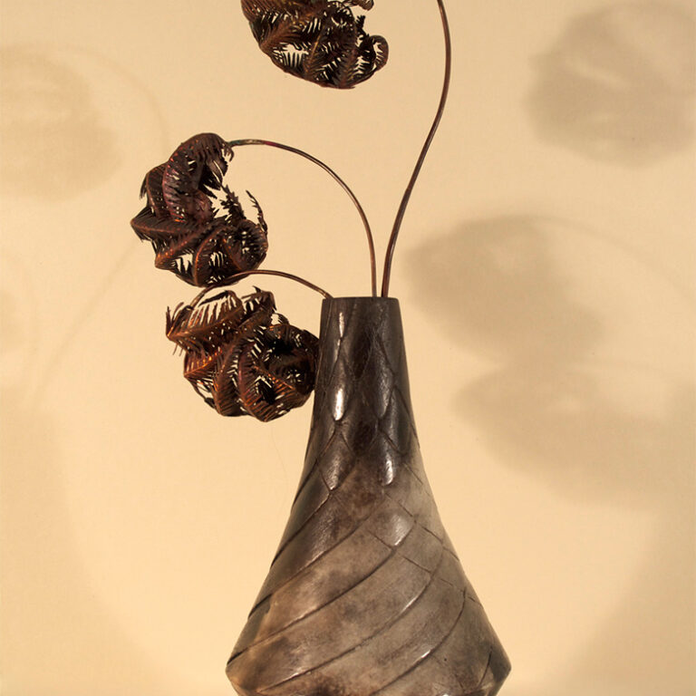 Ceramic pot with wonderful metallic curled up ferns