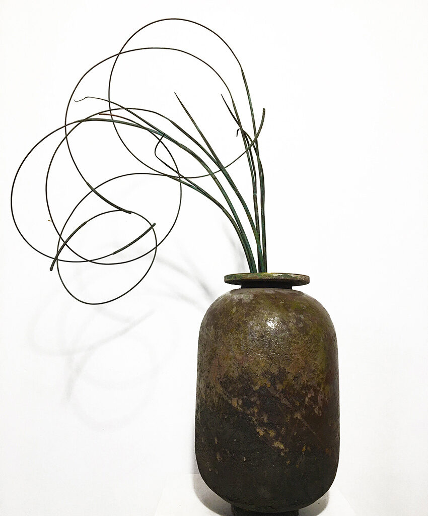 Ceramic pot with elegant fronds